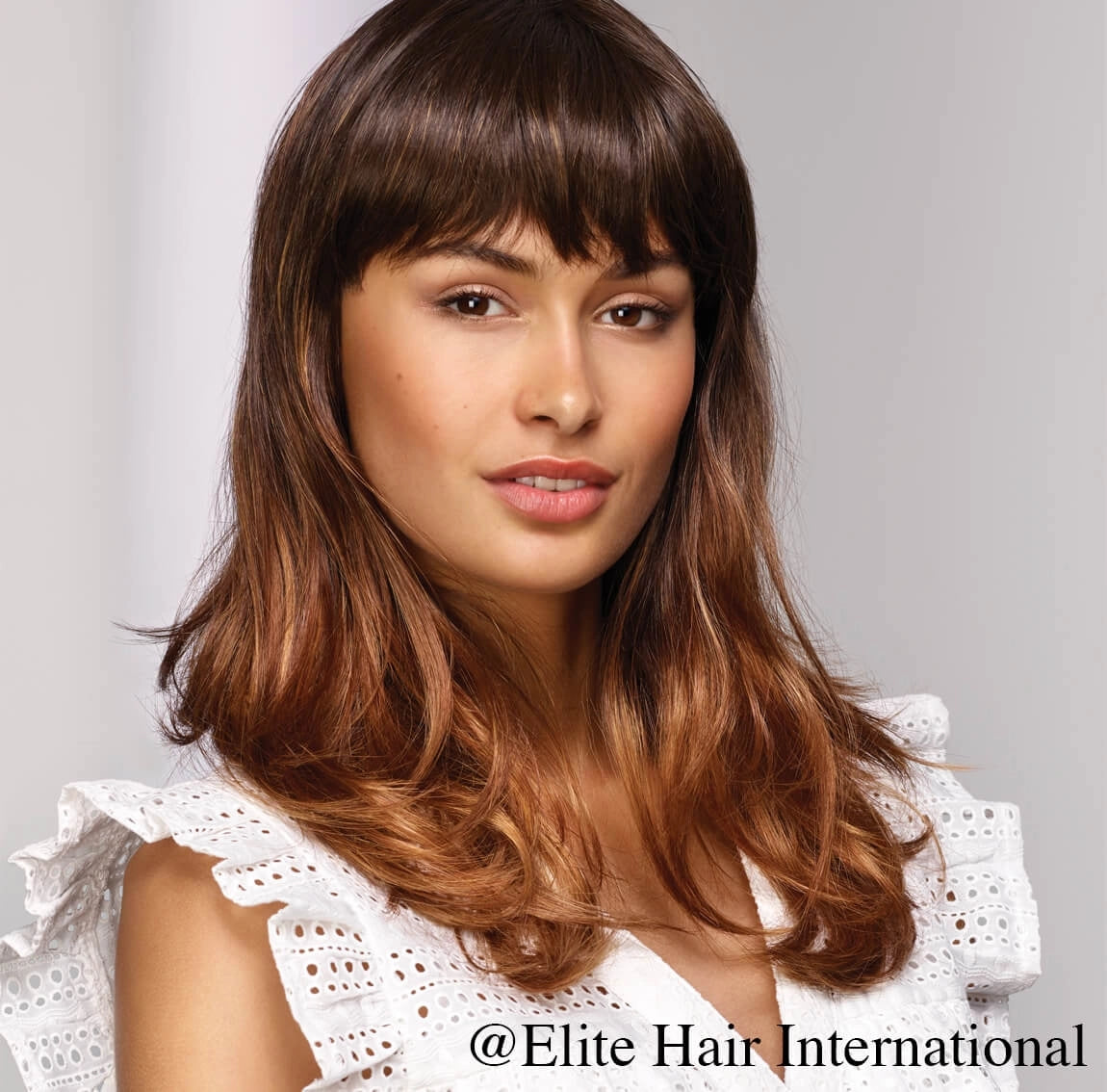 Elite International Captive* long wig with bangs